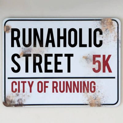 metal street sign running 5